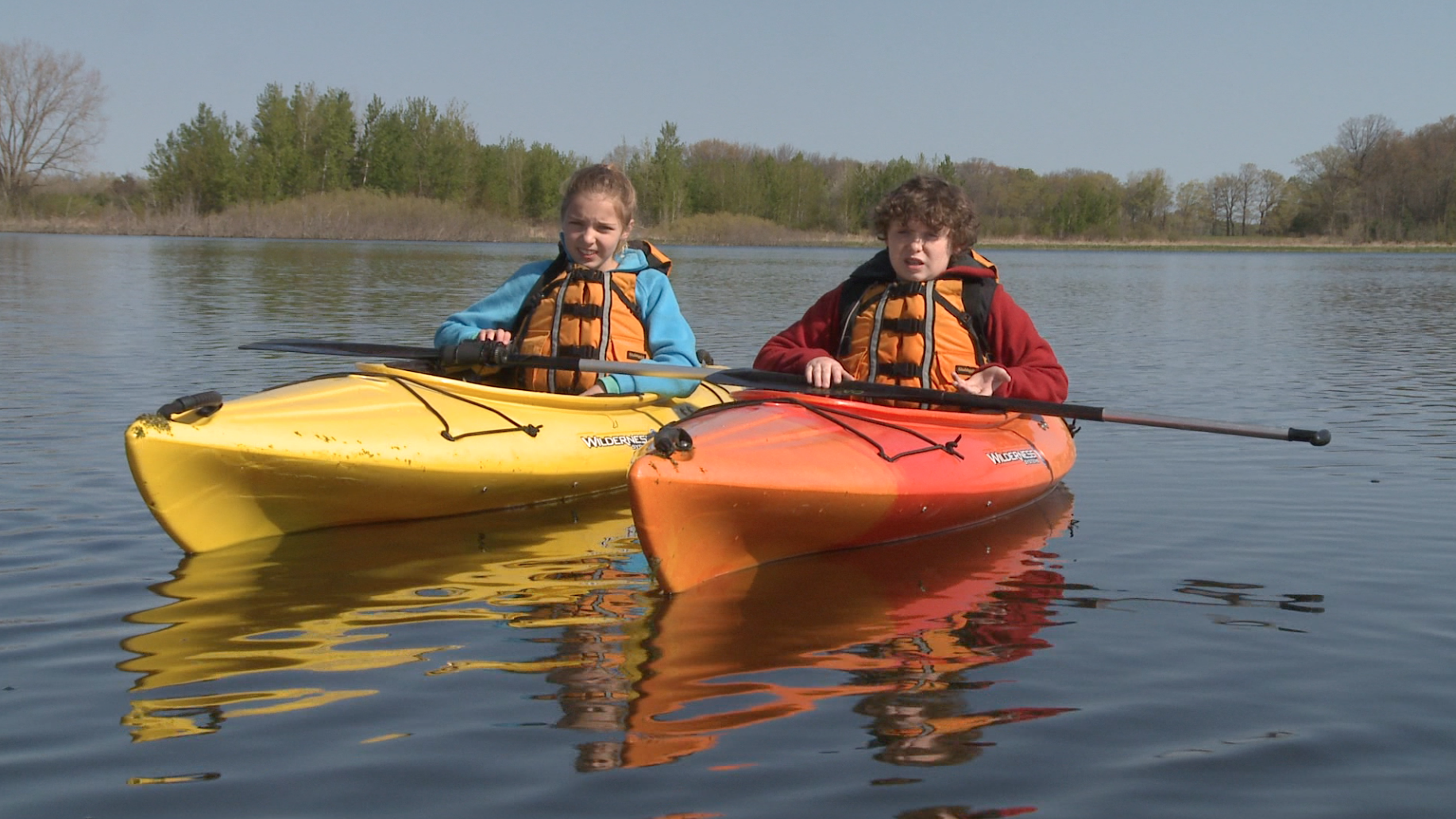2 kids in kayaks